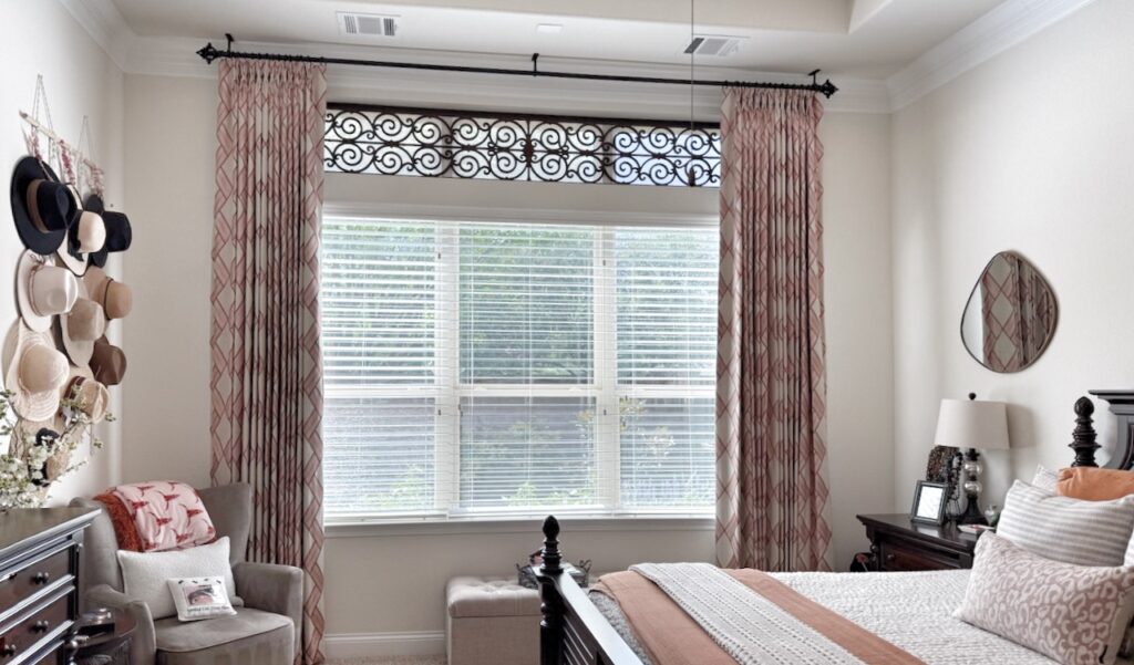Drapery with blackout lining and Tableaux decorative grille in a UT themed master bedroom.