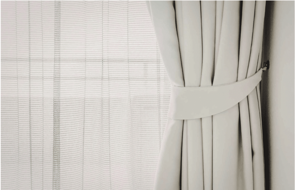 Drapery with tie back and sheer closeup - custom window treatment insulation
