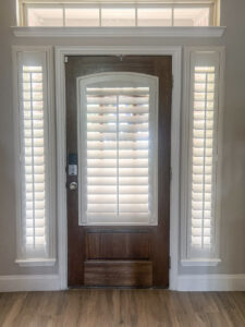 Plantation shutters on front door with sidelights and transom in Keller TX Plantation shutters on front door with sidelights and transom in Keller TX